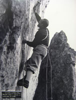 Cassin al Corno del Nibbio sistema un vecchio chiodo. 1951
